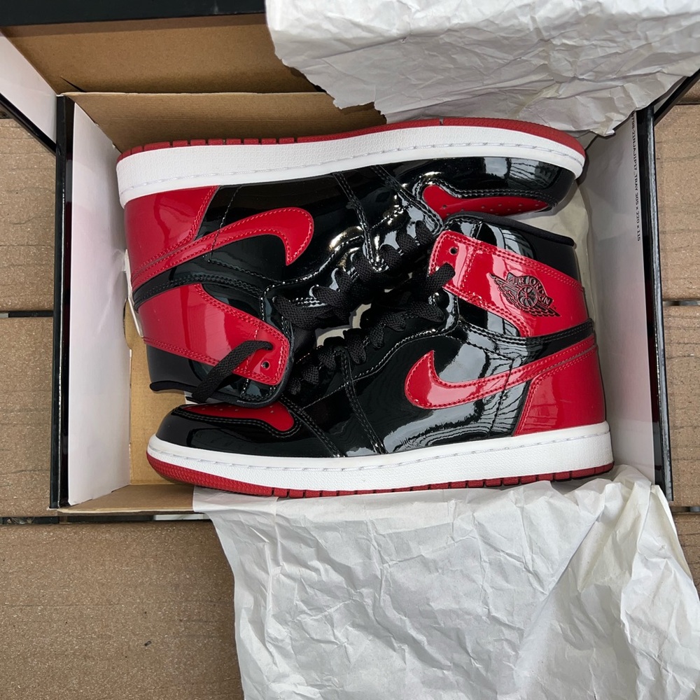 Nike Black and Red Air Jordan Patent Bred 1